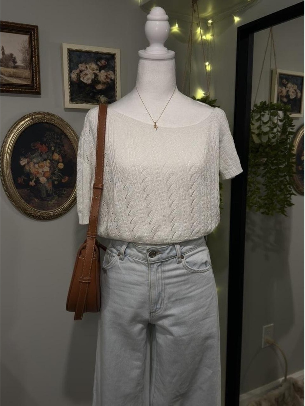 white knit one-shoulder short sleeve top with a cinched waist